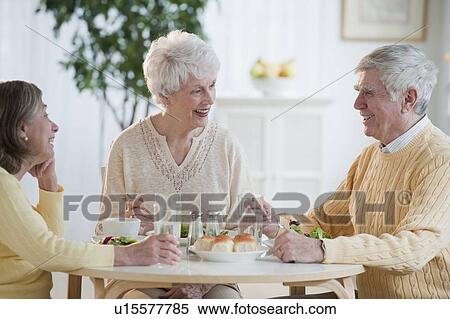 Senior adults eating dinner View Large Photo Image Stock Photography - Senior adults eating dinner. Fotosearch