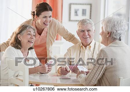Senior adults playing cards View Large Photo Image Stock Photograph - Senior adults playing cards. Fotosearch