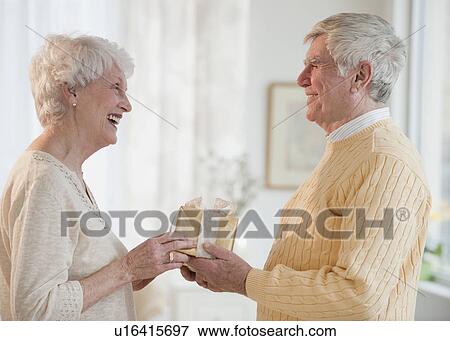Stock Photo - Senior couple celebrating anniversary. Fotosearch