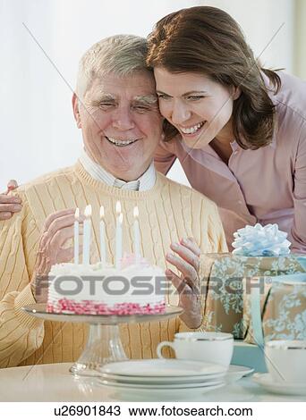 Stock Image - Senior man celebrating birthday. Fotosearch