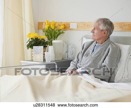 Senior man in hospital bed View Large Photo Image Stock Photo - Senior man in hospital bed. Fotosearch