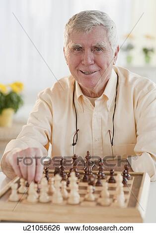 Senior man playing chess View Large Photo Image Stock Photograph - Senior man playing chess. Fotosearch