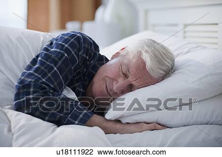 Senior man sleeping in bed View Large Photo Image Stock Image - Senior man sleeping in bed. Fotosearch