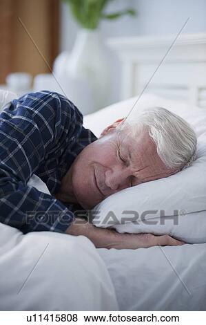 Senior man sleeping in bed View Large Photo Image Stock Photo - Senior man sleeping in bed. Fotosearch