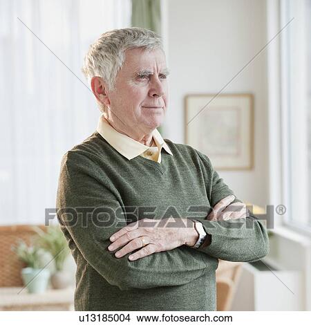 Picture - Senior man with arms crossed. Fotosearch