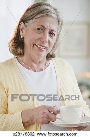 Senior woman drinking tea View Large Photo Image Stock Image - Senior woman drinking tea. Fotosearch