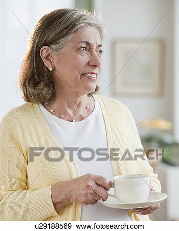Senior woman drinking tea View Large Photo Image Stock Photo - Senior woman drinking tea. Fotosearch