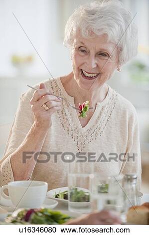 Senior woman eating salad View Large Photo Image Stock Image - Senior woman eating salad. Fotosearch