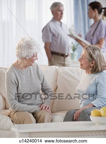 Senior woman talking on sofa View Large Photo Image Picture - Senior woman talking on sofa. Fotosearch