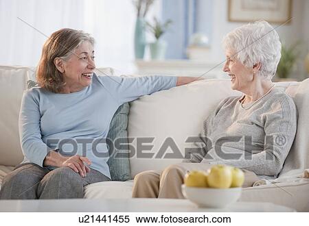 Senior woman talking on sofa View Large Photo Image Stock Photography - Senior woman talking on sofa. Fotosearch