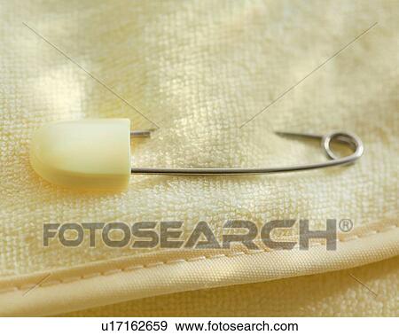Silver baby rattle on stack of money View Large Photo Image Stock Photo - Silver baby rattle on stack of money. Fotosearch