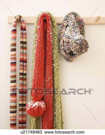 Snowy scarves hanging on rack View Large Photo Image Stock Image - Snowy scarves hanging on rack. Fotosearch