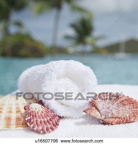 Stock Photograph - Spa towel and seashells. Fotosearch