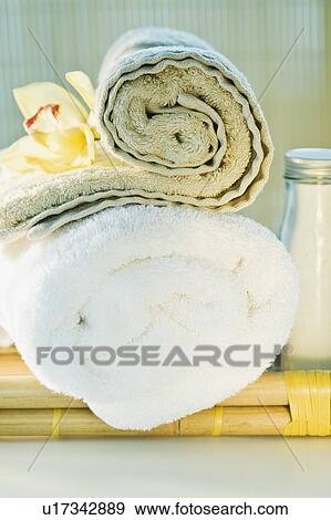 Stock Photo - Spa towels and tropical flower. Fotosearch