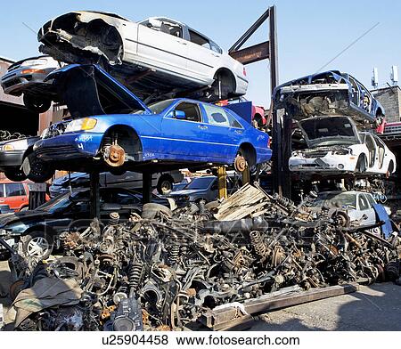 Stack of cars in junkyard View Large Photo Image Stock Photo - Stack of cars in junkyard. Fotosearch