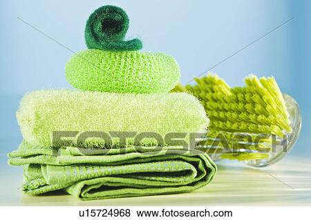 Stack of green cleaning supplies View Large Photo Image Stock Photo - Stack of green cleaning supplies. Fotosearch