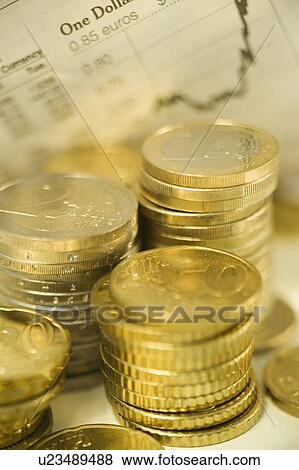 Stacks of euro coins and exchange rates View Large Photo Image Stock Photo - Stacks of euro coins and exchange rates. Fotosearch