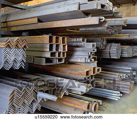 Stock Image - Stacks of raw steel in warehouse. Fotosearch