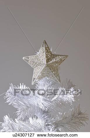 Star on artificial Christmas tree View Large Photo Image Stock Photo - Star on artificial Christmas tree. Fotosearch