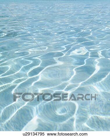 Stock Photography - Sunlight pattern in swimming pool. Fotosearch