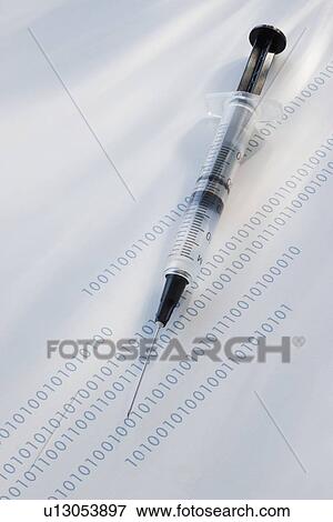 Stock Photo - Syringe on binary code. Fotosearch