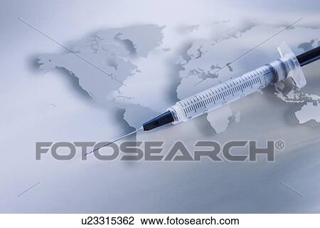 Stock Image - Syringe on world map. Fotosearch
