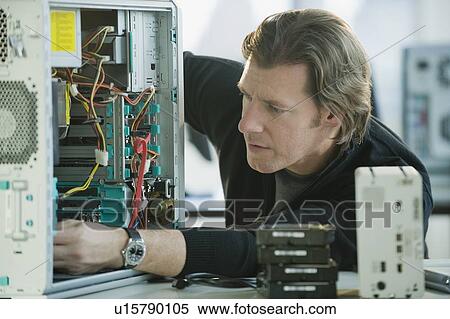 Technician repairing computer View Large Photo Image Stock Photography - Technician repairing computer. Fotosearch