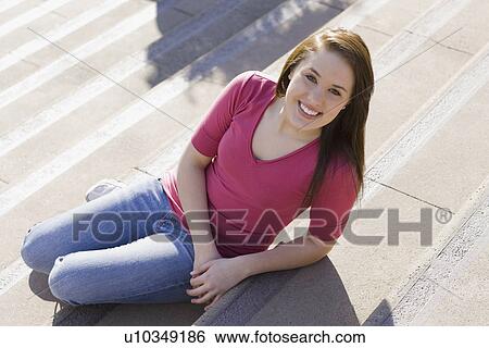 Teenage girl sitting on steps View Large Photo Image Stock Photograph - Teenage girl sitting on steps. Fotosearch