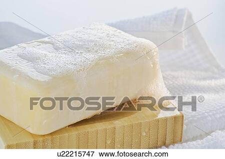 Towel and wet bar of soap View Large Photo Image Stock Photo - Towel and wet bar of soap. Fotosearch