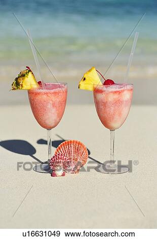 Tropical drinks on beach View Large Photo Image Stock Photo - Tropical drinks on beach. Fotosearch