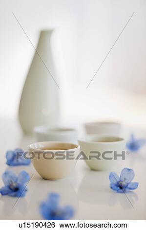 Stock Photograph - Tropical flowers and tea. Fotosearch