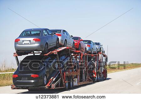 Truck carrying new cars View Large Photo Image Stock Image - Truck carrying new cars. Fotosearch
