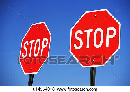Two stop signs View Large Photo Image Stock Photo - Two stop signs. Fotosearch