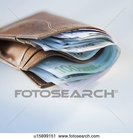 Wallet stuffed with euros View Large Photo Image Stock Image - Wallet stuffed with euros. Fotosearch