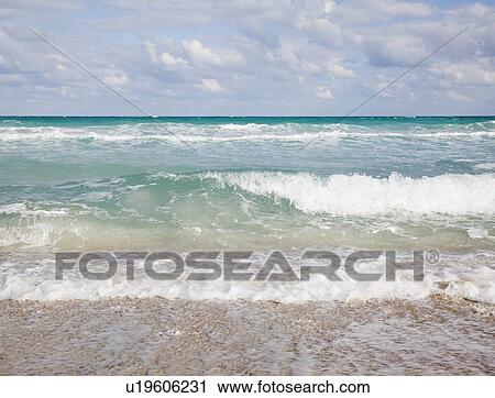 Waves crashing on beach View Large Photo Image Stock Image - Waves crashing on beach. Fotosearch