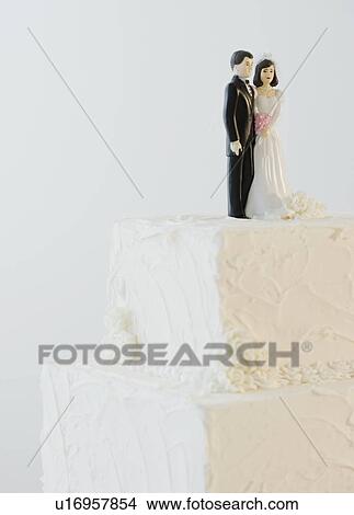 Wedding cake toppers on cake View Large Photo Image Picture - Wedding cake toppers on cake. Fotosearch