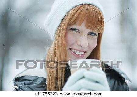Woman drinking coffee in snow View Large Photo Image Stock Image - Woman drinking coffee in snow. Fotosearch