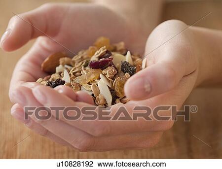 Woman dropping coins in piggy bank View Large Photo Image Stock Image - Woman dropping coins in piggy bank. Fotosearch