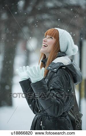 Woman enjoying snow View Large Photo Image Stock Image - Woman enjoying snow. Fotosearch