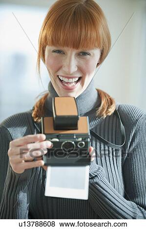 Woman holding vintage camera View Large Photo Image Stock Photo - Woman holding vintage camera. Fotosearch