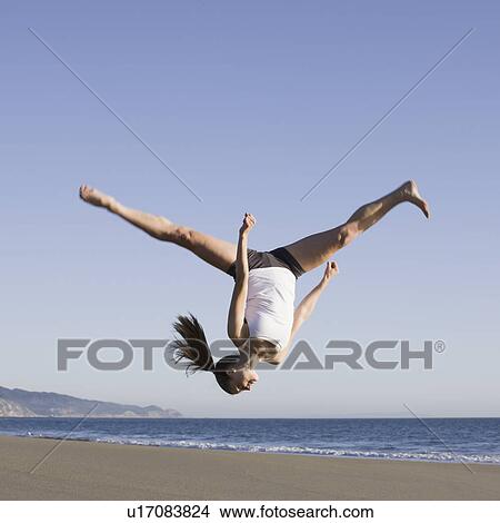 Woman jumping on beach View Large Photo Image Picture - Woman jumping on beach. Fotosearch