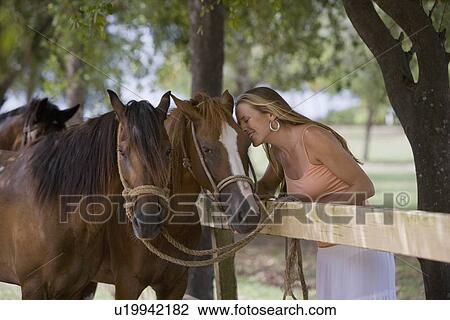 Woman kissing horse View Large Photo Image Stock Image - Woman kissing horse. Fotosearch