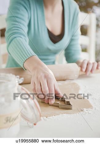 Woman making Christmas cookies View Large Photo Image Stock Image - Woman making Christmas cookies. Fotosearch