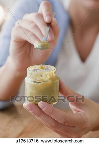Woman making tea View Large Photo Image Stock Photograph - Woman making tea. Fotosearch