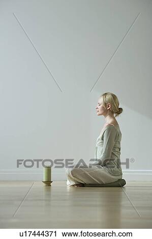 Woman meditating View Large Photo Image Stock Image - Woman meditating. Fotosearch
