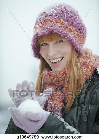 Woman packing snowball View Large Photo Image Stock Photo - Woman packing snowball. Fotosearch