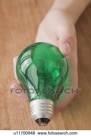 Woman scooping baby food View Large Photo Image Stock Photo - Woman scooping baby food. Fotosearch