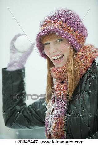 Woman throwing snowball View Large Photo Image Stock Photo - Woman throwing snowball. Fotosearch