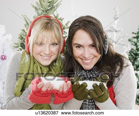Women holding snow View Large Photo Image Stock Photo - Women holding snow. Fotosearch