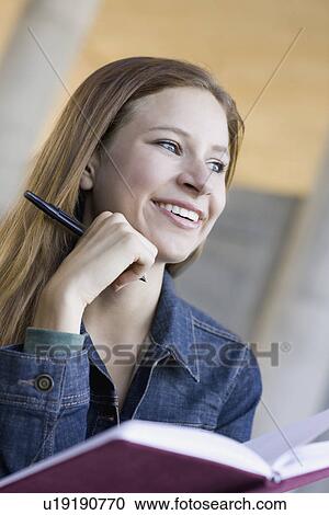 Young woman reading View Large Photo Image Stock Image - Young woman reading. Fotosearch